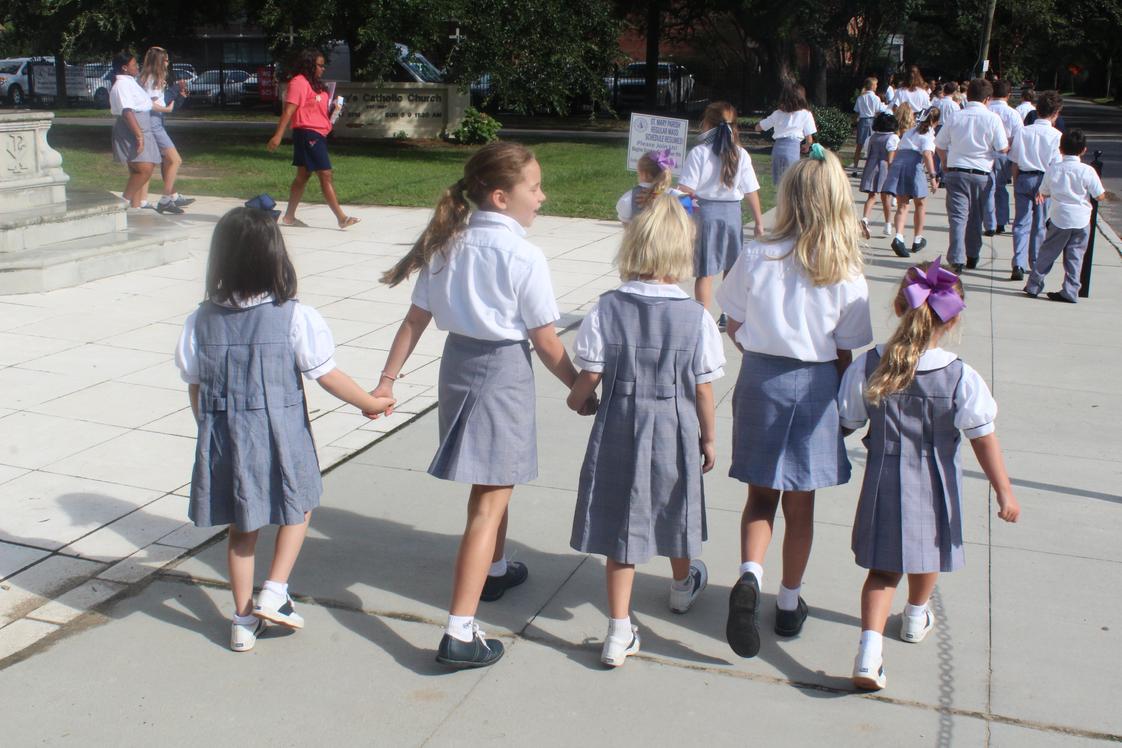 St. Mary Catholic School Photo - St. Mary Fifth Grade Buddies walk their Little Kindergarten Buddies back to class after the Friday Student Mass