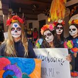 St. Michael's School Photo #7 - St. Michael's integrates local culture and traditions with celebrations and presentations of student learning, including the annual Dia de los Muertos chapel. Ofrendas with pictures of lost loved ones (human and pets) are displayed amongst the sugar skeletons and marigolds.