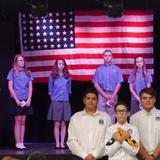 Wickenburg Christian Academy Photo #4 - Annual Veterans Day Chapel: 7th & 8th Graders conduct a flag folding ceremony, explaining significance of each of the 13 folds. Students are encouraged to bring a family member, friend or neighbor to honor for their service.