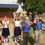 Wickenburg Christian Academy Photo - WCA students used special glasses that were donated so they could experience the Solar Eclipse in what may be a once-in-a-lifetime event. Now, there's a bright idea!