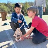 Brandeis Marin Photo #5 - Middle school students take their catapult designs to be tested with the help of their Kindergarten buddies.
