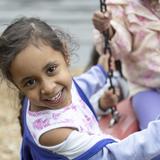Grace Episcopal Day School Photo #5 - Riding on the tire swing is a popular activity on our Early Childhood playground.