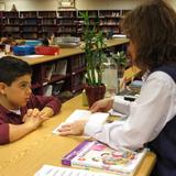 School Of The Incarnation Photo #5 - Students visit the school library with their class on a weekly basis.