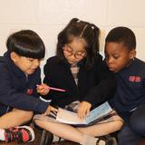 St. Martin of Tours School Photo #3 - Students from different grade levels learning and connecting together.