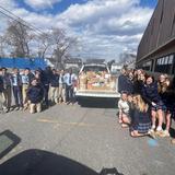 St. Ursula School Photo #3 - Middle school students load up donations for a local food bank.