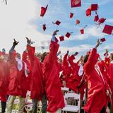 Catholic Memorial Photo - Members of the Class of 2024 throw their caps into the sky during commencement ceremonies.