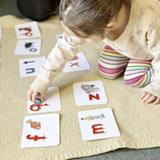 King's Wood Montessori School Photo #4 - Building words, building confidence: A student explores sounds and letters using the Montessori Moveable Alphabet, laying the foundation for early literacy through hands-on learning