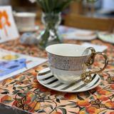 King's Wood Montessori School Photo #7 - Each spring, our kindergarten class hosts a cherished tradition - Spring Tea. Students invite a special guest to share in an afternoon of conversation, handmade gifts, and heartfelt hospitality