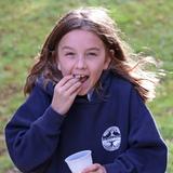 The Imago School Photo #2 - Enjoying popcorn on a breezy fall afternoon from the new popcorn machine at recess!