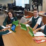 St. Germaine Catholic School Photo #8 - Some of our eighth graders using the iPads for a cooperative group assignment.