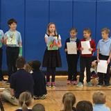 St. Mary Catholic School Photo - Third Grade presented about Joan of Arc during Morning Prayer.