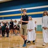 Faithful Shepherd Catholic School Photo #2 - Every Wednesday our students celebrate mass together in our school gym. Students participate in the mass by leading the choir, reading, and carrying up the offertory gifts. Faith and service are closely linked. Students learn the importance of service to others through Advent and Lenten service projects, Monthly Faith in Action Fridays and Middle School service hours.