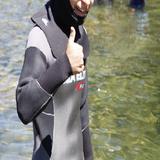 Mount Ellis Academy Photo #5 - There are many fun and interesting opportunities at outdoor school (a week-long camping trip to kick off the school year). In this picture an MEA student dons a wetsuit before snorkeling.