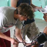 Mount Ellis Academy Photo #8 - Every other year, Mount Ellis Academy takes students on a mission trip. In this photo an MEA student monitors a patient's blood pressure during a mission trip to Peru.