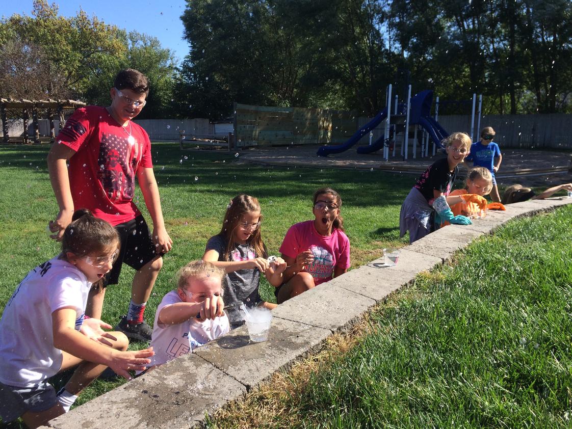 St. John Lutheran School Photo #1 - St. John's 6th-grade dry ice science experiment in front of the outdoor classroom.