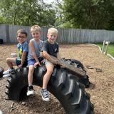 St. John Lutheran School Photo #2 - Students take flight on their imaginary aircraft in the outdoor classroom.
