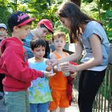 Jewish Community Day School, Inc Dba Jcds Bostons Photo #5 - A Middle School student helps Lower School students prepare for participation in a Tashlich ceremony.