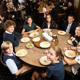 Rumson Country Day School Photo #2 - Lunch is served family style in our dining room. Each table is thoughtfully comprised of mixed age students and one faculty or staff member.