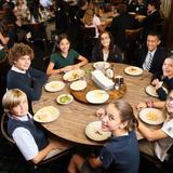 The Rumson Country Day School Photo - Lunch is served family style in our dining room. Each table is thoughtfully comprised of mixed age students and one faculty or staff member.