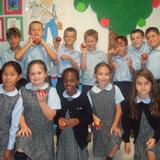 St. Rose Grammar School Photo #1 - St. Rose Grammar School third grade students from Ms. Mary Burns' class celebrated Johnny Appleseed's birthday by making homemade applesauce in their classroom.