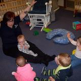 Springdale Road KinderCare Photo #1 - Ms. Lisa doing circle time with the infants.