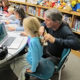 Rio Grande School Photo - 1st grader with our Technology Director in the Media Lab.