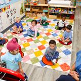 Buckley Country Day School Photo #3 - Nursery students practice counting and number recognition together, building early math skills through an engaging classroom activity.