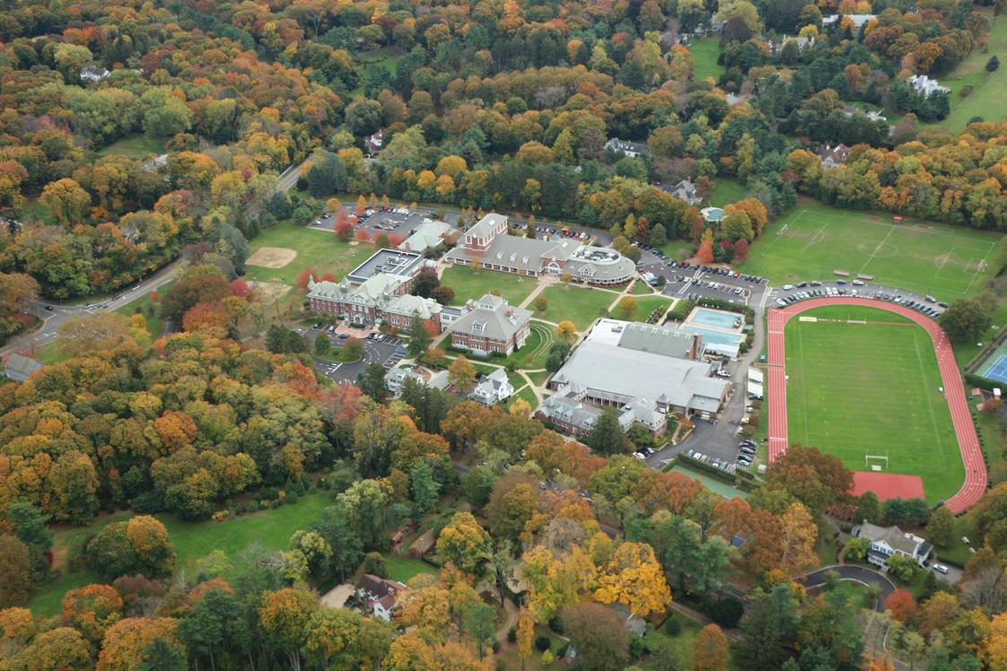 Friends Academy Photo #1 - Our 65-acre campus is designed to provide students with both a serene and stimulating backdrop thatenriches their educational experience. Our expansive athletic fields and state-of-the-art theater foster our creative spirit and fuel our competitive edge. At the center of our academic buildings lies our beautiful Quad, which is a gathering point for our entire community.