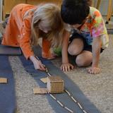 Montessori School Of Syracuse Photo #6 - Working Together on Long Bead Chain