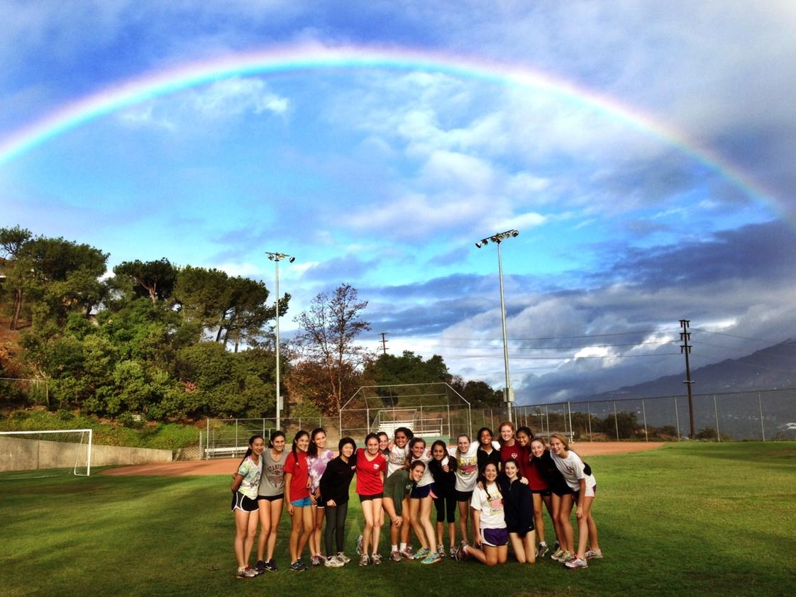 Flintridge Sacred Heart Academy Photo #1 - FSHA's cross country team on the field after the rain.