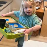 Santa Rosa Montessori Photo #4 - Exploring geography with our hands! This Montessori lesson on land and water forms helps children truly understand the difference between a lake and an island. Through hands-on discovery, abstract concepts become real and memorable.