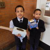 St. Francis Of Assisi Catholic Academy Photo - Two Kindergarten children show their recycled creations!