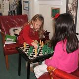 Thevenet Montessori School Photo #4 - Students in our lower elementary classroom playing chess.