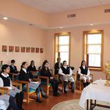Villa Maria Academy Photo #3 - 2nd-grade students practicing for the Sacrament of Communion with Father Pergjini in the chapel of the convent located right on campus.