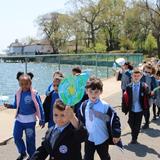 Villa Maria Academy Photo #6 - Children march on the beautiful campus track along the water during an Earth Day Parade.