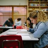 Greensboro Montessori School Photo #18 - An eighth grader takes a test in history class. Our Montessori curriculum meets the North Carolina Standard Course of Study for middle school.