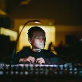 Greensboro Montessori School Photo #13 - A sixth grader runs the sound board for the annual Upper Elementary spring theatrical production.