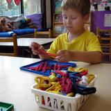 Lucy Daniels School Photo - Young boy develops his manual dexterity and geometry skills in the Child Enrichment Preschool Program