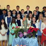 Our Lady Of Mercy Catholic School Photo - Eighth graders lead our school's annual May Crowning ceremony each May. Passing on the Christian faith is central to who we are.