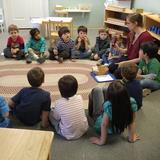 Pinewoods Montessori Schoolcorp Photo #2 - The toddlers sit in circle time with their teacher, Miss Brandy.