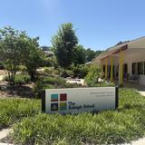 The Raleigh School Photo #1 - Spread across 18 wooded acres, TRS feels less like a traditional school than a village that has grown organically from the land. Warm wood buildings rise naturally from the landscape, echoing the forest just beyond the door.