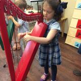 Grand Forks Montessori Academy Photo #6 - During our regular music classes. children have opportunities to try new instruments, learn beginning music theory and be exposed to various music styles.