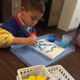 Grand Forks Montessori Academy Photo #5 - Painting while incorporating learning about the continents.