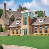 Gilmour Academy Photo - Tudor House behind the new Howley Commons