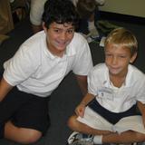 St. Gertrude School Photo #5 - An 8th grade and 1st grade student from St Gertrude enjoy a pause during a collaborative project promoting school community.