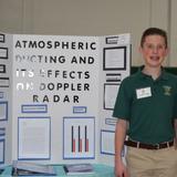 St. Helen Elementary School Photo #6 - An 8th Grade student stands with his first place science fair project.