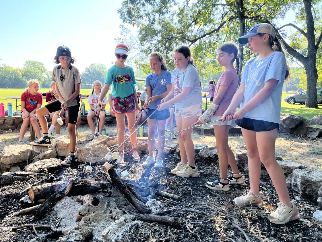 Holland Hall Photo #1 - More space to learn and grow. Here our Primary School students make some campfire S'Mores during an outdoor unit. S'More?! How can I have more when I haven't had any?! *Bonus points for knowing the quote*