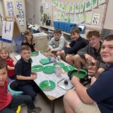 Metro Christian Academy Photo #15 - 7th-grade Life Skills students joined Kindergarten to celebrate Dr. Seuss with green eggs and ham, reading books, and playing games together.