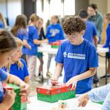 Rejoice Christian School Photo #3 - A 5th-grade student is preparing boxes for Operation Christmas Child 2025.