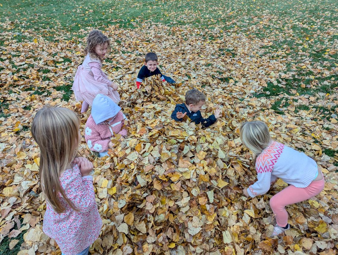 La Grande Adventist Christian School Photo #2 - Having fun playing in the leaves that blow into the playground!